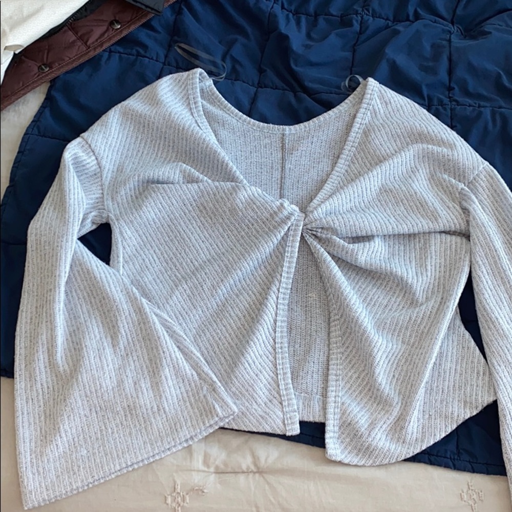 Cross in the back, beautiful bell sleeves